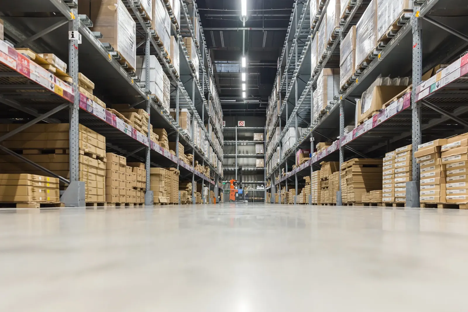 Warehouse aisles with racked cartons